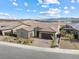 Aerial shot of a single-story home with a lake view, and xeriscaped front yard at 160 Stone Mesa Ct, Henderson, NV 89011