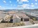 Stunning aerial view of single-story home with a lake view, plus xeriscaped yard and modern design at 160 Stone Mesa Ct, Henderson, NV 89011