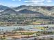 Aerial view of luxurious community nestled near a serene lake and golf course at 160 Stone Mesa Ct, Henderson, NV 89011