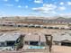 Aerial view highlights the backyard, pool, patio, and the house's place in the community at 160 Stone Mesa Ct, Henderson, NV 89011