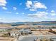 Stunning aerial view of a lakeside community with mountain views at 160 Stone Mesa Ct, Henderson, NV 89011
