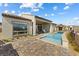 This backyard includes a pool, a patio, and neighborhood views at 160 Stone Mesa Ct, Henderson, NV 89011