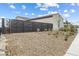 Backyard view displaying modern fencing and desert landscaping at 160 Stone Mesa Ct, Henderson, NV 89011