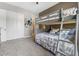 Comfortable bedroom with a bunk bed, soft carpet, and a closet at 160 Stone Mesa Ct, Henderson, NV 89011