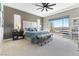 Inviting bedroom featuring a king-size bed and large window overlooking the pool at 160 Stone Mesa Ct, Henderson, NV 89011