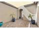 Private courtyard with plants, archway and desert landscaping at 160 Stone Mesa Ct, Henderson, NV 89011