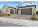 Beautiful home featuring a two-car garage and desert landscaping at 160 Stone Mesa Ct, Henderson, NV 89011