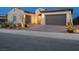 Beautiful single-story home featuring a three-car garage and professionally landscaped front yard at 160 Stone Mesa Ct, Henderson, NV 89011
