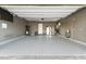 Spacious three-car garage featuring sealed floors, overhead storage, and ample room at 160 Stone Mesa Ct, Henderson, NV 89011