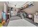 Three-car garage with sealed floors and storage racks, offering parking and storage space at 160 Stone Mesa Ct, Henderson, NV 89011
