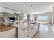 Open-concept kitchen features a large island, stainless steel appliances, and seamless flow to the living area at 160 Stone Mesa Ct, Henderson, NV 89011