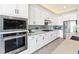 Kitchen featuring stainless steel appliances and sleek white cabinetry at 160 Stone Mesa Ct, Henderson, NV 89011