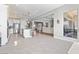 Spacious kitchen with an island and stainless steel appliances that opens up to the living room and outdoor space at 160 Stone Mesa Ct, Henderson, NV 89011