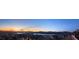 Expansive panoramic view of the lake and mountains at dusk from a desirable community at 160 Stone Mesa Ct, Henderson, NV 89011