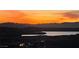 Scenic sunset view overlooking the lake and mountains from this beautiful property at 160 Stone Mesa Ct, Henderson, NV 89011
