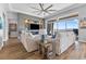 Inviting living room featuring a ceiling fan, neutral walls and sliding glass doors at 160 Stone Mesa Ct, Henderson, NV 89011