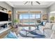 Well-lit living room with large sliding doors and a view of the backyard pool at 160 Stone Mesa Ct, Henderson, NV 89011