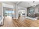 Open-concept living room with wood floors and modern furnishings at 160 Stone Mesa Ct, Henderson, NV 89011