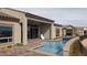 Pool and spa offer serene lake views, creating an inviting outdoor escape at 160 Stone Mesa Ct, Henderson, NV 89011