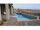 The pool and spa offer serene desert views and a luxurious outdoor living space at 160 Stone Mesa Ct, Henderson, NV 89011