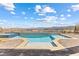 Backyard oasis with a sparkling pool, spa, and captivating views of the desert landscape at 160 Stone Mesa Ct, Henderson, NV 89011