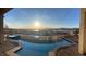 Enjoy this backyard pool and spa with stunning views of the lake and mountains at 160 Stone Mesa Ct, Henderson, NV 89011