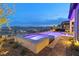 Outdoor spa and pool with breathtaking sunset and mountain views at 160 Stone Mesa Ct, Henderson, NV 89011