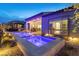 Backyard pool with baja shelf, lounge area, and patio at 160 Stone Mesa Ct, Henderson, NV 89011