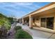Spacious covered patio and landscaped backyard providing a relaxing outdoor living space at 1700 Wellington Springs Ave, Henderson, NV 89052