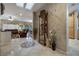 Elegant foyer with tile flooring, decorative inlays, and stylish display cabinet, leading to the living area at 1700 Wellington Springs Ave, Henderson, NV 89052