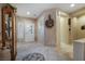 Welcoming foyer with tile flooring, decorative details, and a view into the adjacent hallway at 1700 Wellington Springs Ave, Henderson, NV 89052