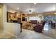 Cozy living room with tile flooring, built-in cabinets, comfortable seating, and natural light at 1700 Wellington Springs Ave, Henderson, NV 89052