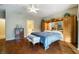 Comfortable main bedroom showcases wood floors and built-in cabinetry for ample storage at 1700 Wellington Springs Ave, Henderson, NV 89052