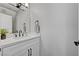 Clean bathroom with white vanity, modern faucet, and neutral tones at 1800 Montvale Ct, Las Vegas, NV 89134