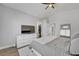 Bright bedroom with a TV, wood floors, and vaulted ceilings at 1800 Montvale Ct, Las Vegas, NV 89134
