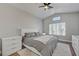 Bright bedroom with a ceiling fan, wood floors, and vaulted ceilings at 1800 Montvale Ct, Las Vegas, NV 89134