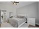 Bright bedroom with a ceiling fan, wood floors, and large mirror at 1800 Montvale Ct, Las Vegas, NV 89134