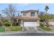 Charming two-story home featuring a well-maintained yard, tile roof, and attached two-car garage at 1800 Montvale Ct, Las Vegas, NV 89134