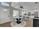 Bright kitchen and dining area features quartz counters, a modern ceiling fan, and natural light at 1800 Montvale Ct, Las Vegas, NV 89134