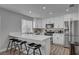 Stylish kitchen features white cabinets, quartz countertops, and stainless steel appliances at 1800 Montvale Ct, Las Vegas, NV 89134