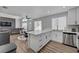 Modern, open-concept layout connecting kitchen, living, and dining areas offers an inviting atmosphere at 1800 Montvale Ct, Las Vegas, NV 89134