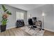 Bright home office with a desk, chair, and wood floors at 1800 Montvale Ct, Las Vegas, NV 89134