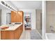 Bathroom with double sink vanity, modern lighting, walk-in shower, and walk-in closet at 200 W Sahara Ave # 801, Las Vegas, NV 89102
