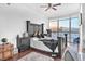 Bedroom featuring a king bed, ceiling fan, and desk area with scenic window views at 200 W Sahara Ave # 801, Las Vegas, NV 89102