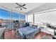 Bright bedroom with large windows offering scenic city views, a bed, and a cozy chair at 200 W Sahara Ave # 801, Las Vegas, NV 89102