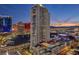 Stunning exterior view of a tall residential building with a pool, city and mountain views at 200 W Sahara Ave # 801, Las Vegas, NV 89102