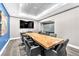 Professional conference room with live edge table, large screen and comfortable seating at 200 W Sahara Ave # 801, Las Vegas, NV 89102