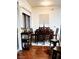 Elegant dining area with a wood table set for six, complemented by a stylish bar cart and hardwood floors at 200 W Sahara Ave # 801, Las Vegas, NV 89102