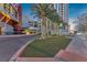 Elegant Allure Las Vegas entrance with manicured landscaping and mature palm trees at 200 W Sahara Ave # 801, Las Vegas, NV 89102