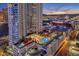 High-rise with a pool and outdoor lounge area, overlooking city lights and mountain scenery at 200 W Sahara Ave # 801, Las Vegas, NV 89102